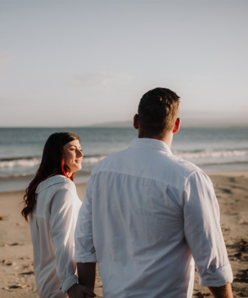 Mcmf couple walking beach and sea